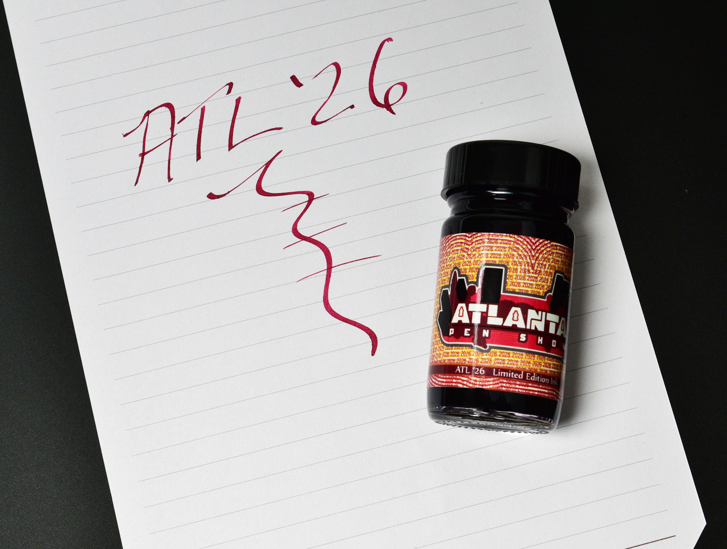 Bottle of Atlanta Peach Schnapps on a piece of paper with scribbles