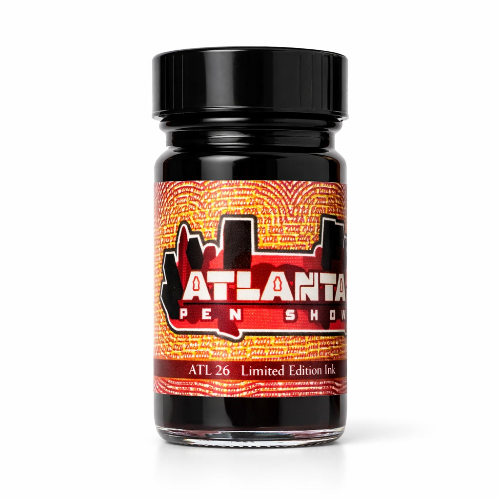 Jar of Atlanta Pen Show ink with a black lid on a white background
